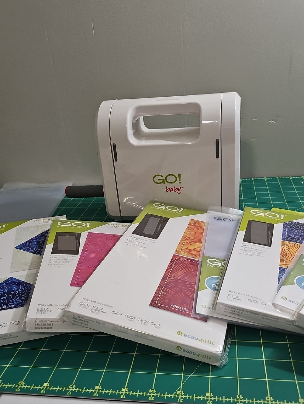 AccuQuilt GO! Baby Fabric Cutter - White with Green Logo and 5 Dies/templates.